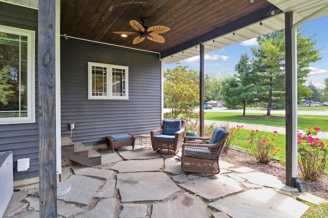 view of patio with ceiling fan and an outdoor living space