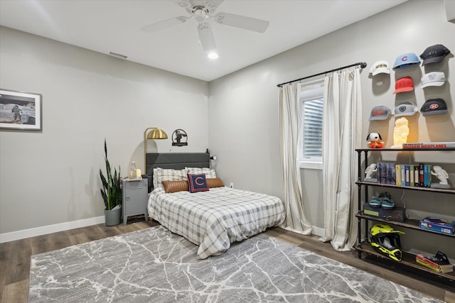 bedroom with ceiling fan and hardwood / wood-style flooring