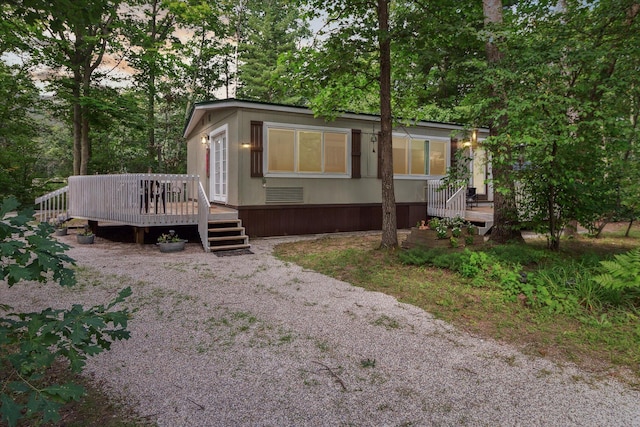 view of front of home featuring a wooden deck