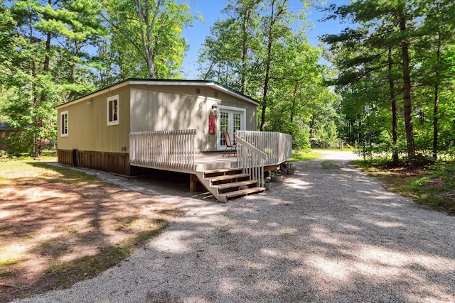 view of side of property with a wooden deck