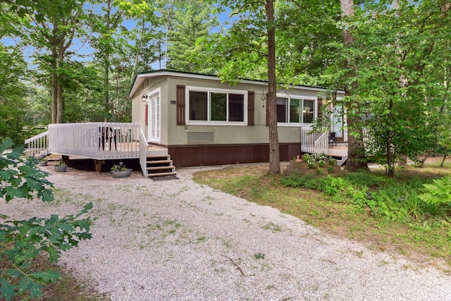 view of front of home with a wooden deck