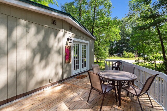 8529 N Blair Dr, Bitely, MI 49309 - deck featuring french doors and outdoor dining space