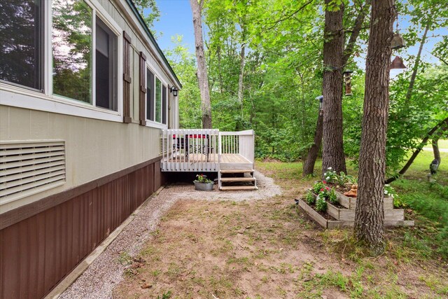 8529 N Blair Dr, Bitely, MI 49309 - view of yard featuring a deck
