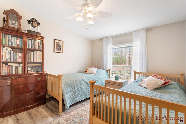 bedroom featuring ceiling fan and light hardwood / wood-style flooring