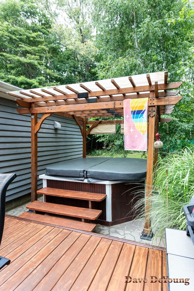 exterior space with a pergola, a hot tub, and a deck