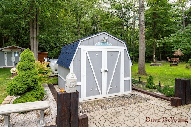 view of outbuilding with a lawn