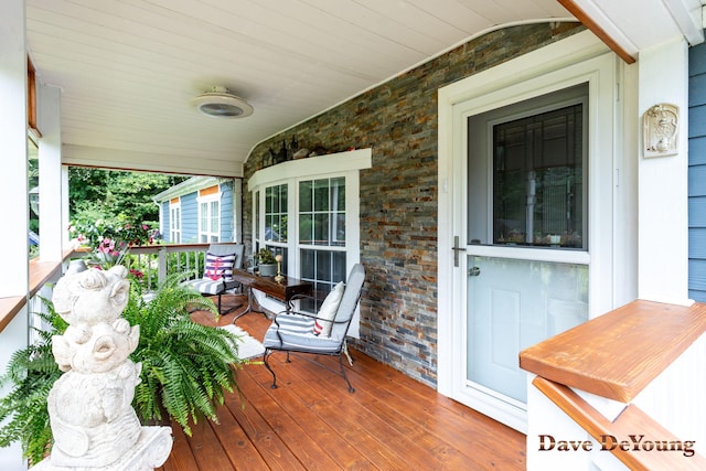 wooden deck featuring covered porch