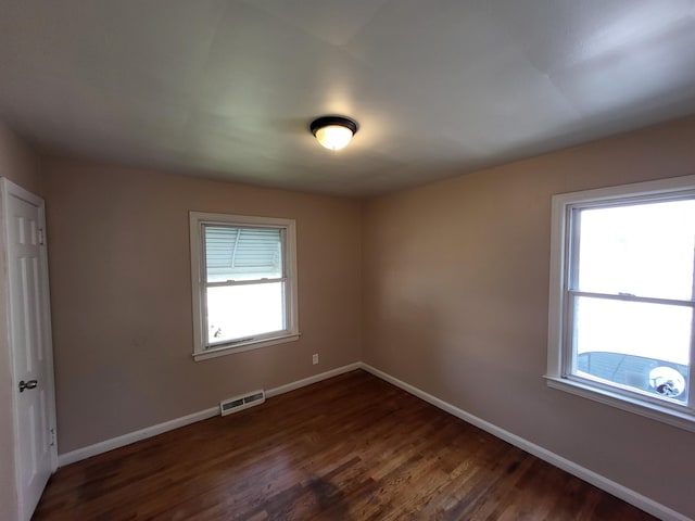 empty room featuring dark hardwood / wood-style floors