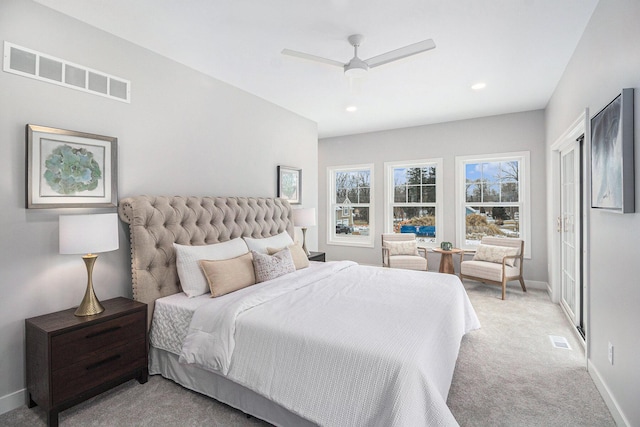 carpeted bedroom with ceiling fan