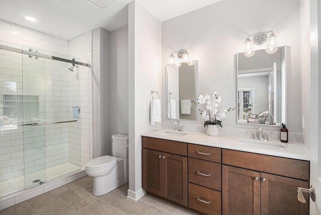 bathroom with vanity, an enclosed shower, tile patterned flooring, and toilet