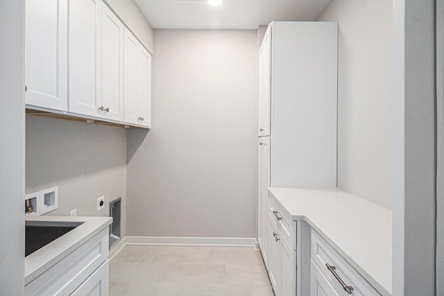 laundry room with washer hookup, cabinets, and hookup for an electric dryer