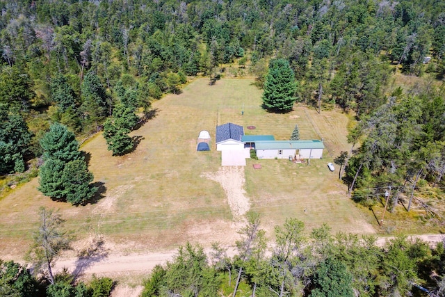 birds eye view of property with a rural view