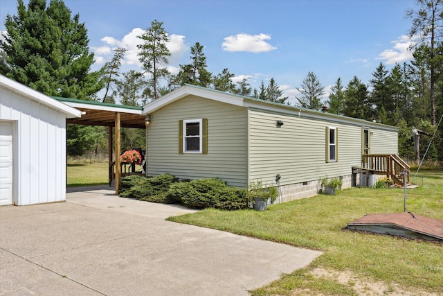 view of property exterior with a yard