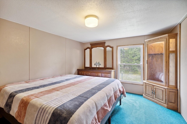 carpeted bedroom with a textured ceiling