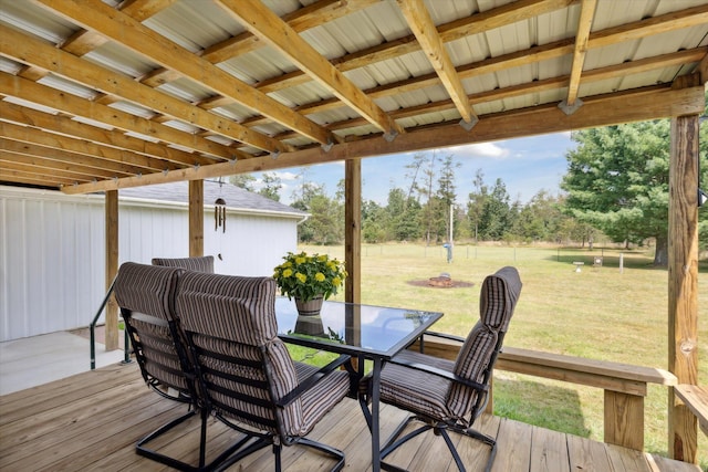 wooden deck featuring a lawn