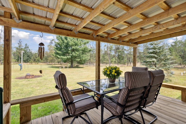 deck with a lawn and a fire pit