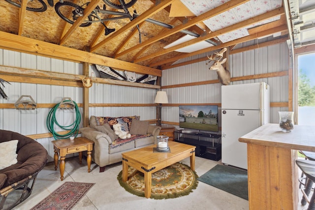 living room featuring vaulted ceiling