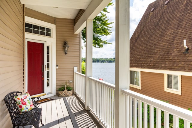 doorway to property with a water view