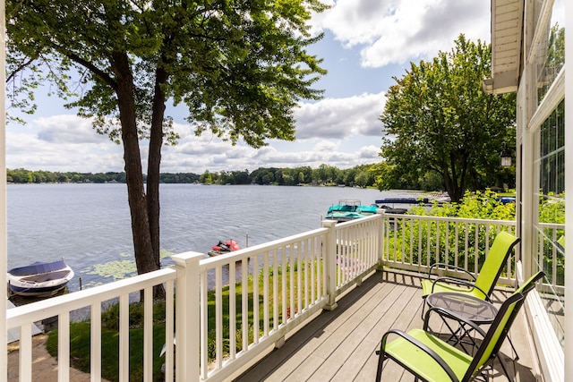 wooden deck with a water view