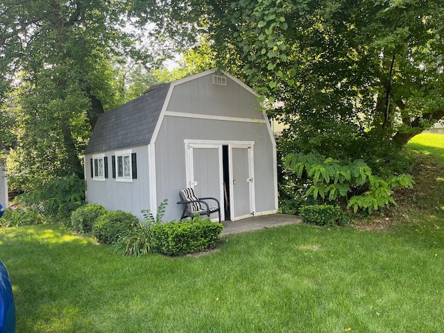 view of outdoor structure with a lawn