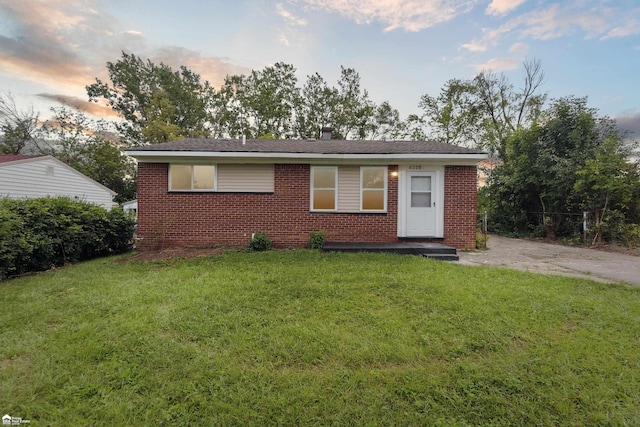 view of front of property with a lawn