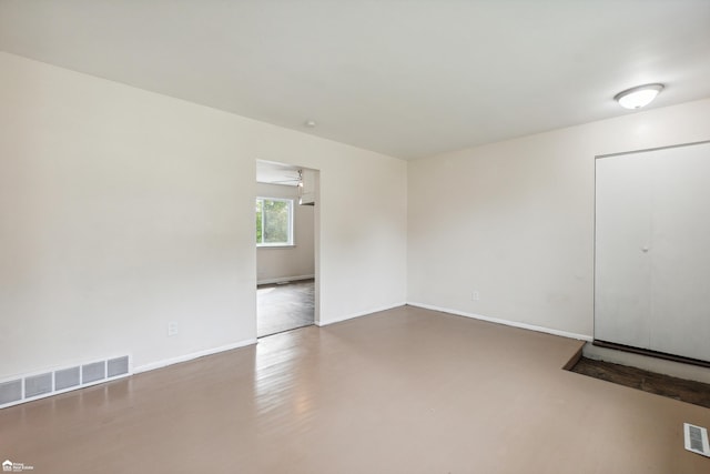 spare room featuring wood-type flooring