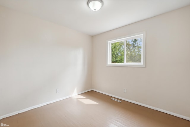 empty room with wood-type flooring