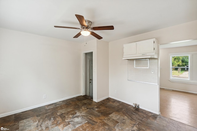 spare room with ceiling fan