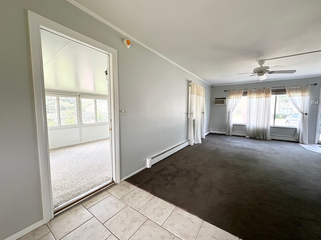 spare room with baseboard heating, light carpet, crown molding, and ceiling fan