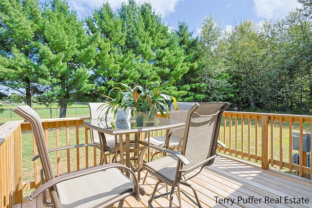 deck featuring a lawn