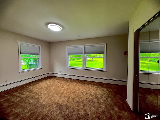 empty room featuring dark carpet