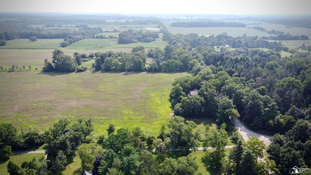 birds eye view of property with a rural view