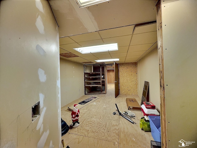 basement featuring a drop ceiling