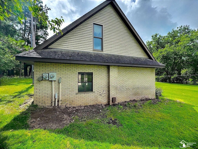 view of property exterior with a yard