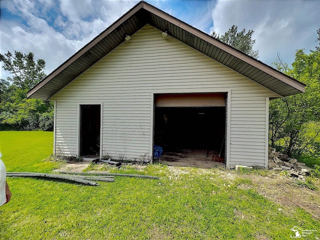 garage featuring a yard