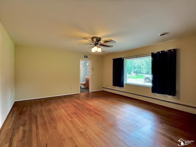 empty room with hardwood / wood-style floors, ceiling fan, and a baseboard radiator