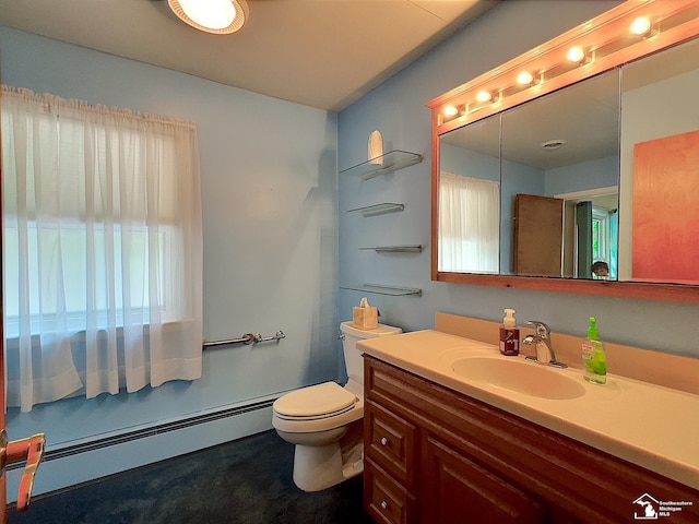 bathroom featuring vanity, toilet, and a baseboard heating unit