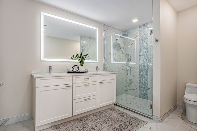 bathroom with vanity, toilet, and walk in shower