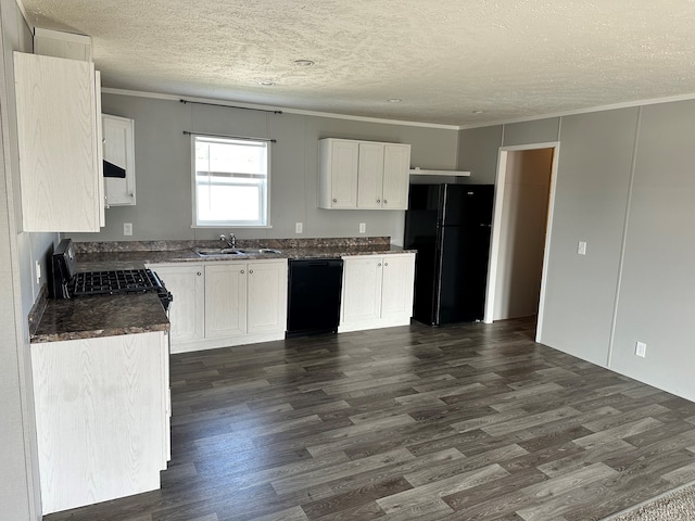 kitchen featuring dark hardwood / wood-style flooring, crown molding, sink, black appliances, and white cabinets