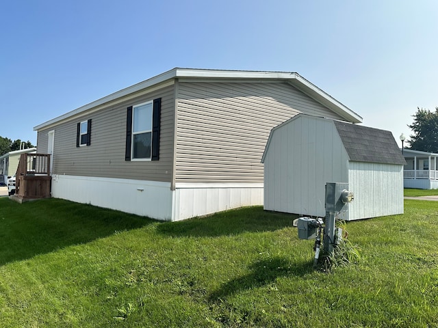 view of property exterior featuring a shed and a lawn