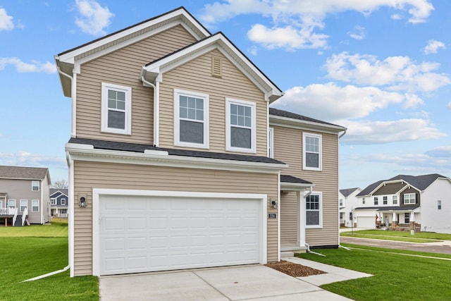 view of front of home with a front lawn and a garage