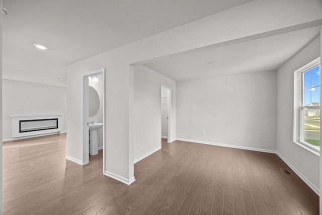 unfurnished room featuring wood-type flooring