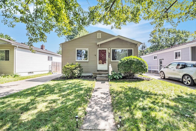 bungalow with a front lawn