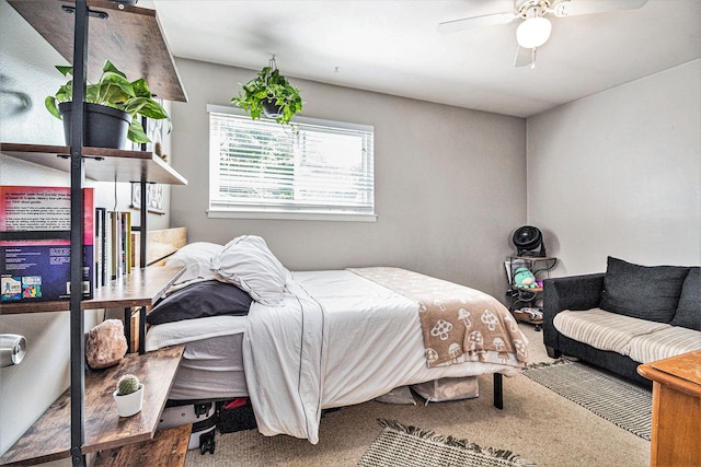 bedroom featuring ceiling fan and carpet floors