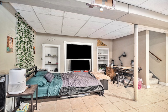 tiled bedroom with a drop ceiling