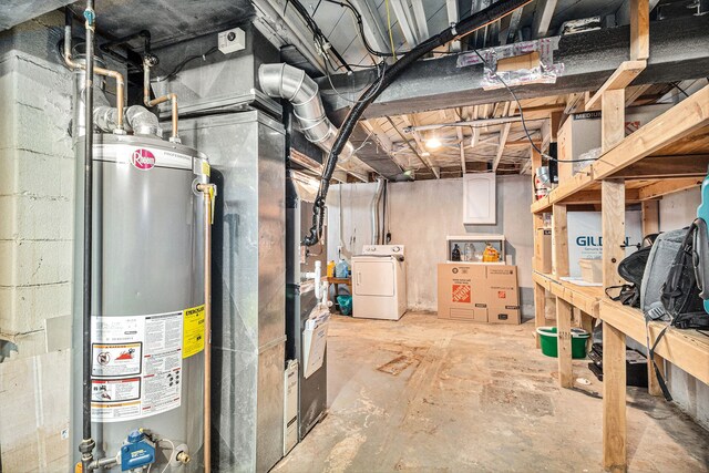 basement with gas water heater and washer / clothes dryer