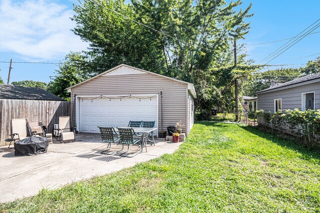 garage featuring a lawn