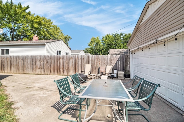 view of patio with a garage