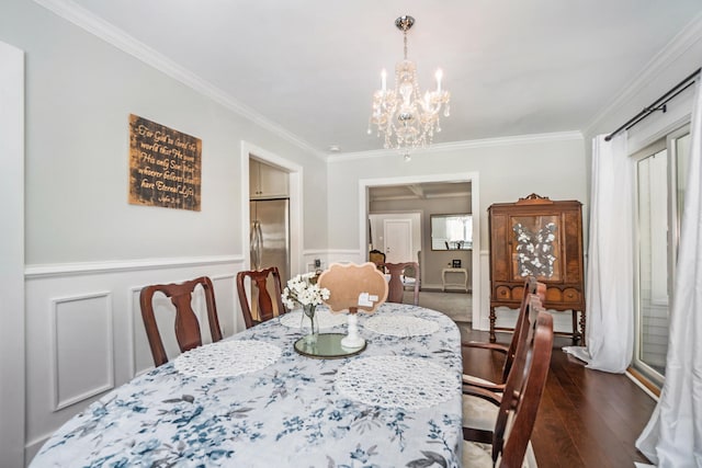 dining space with a chandelier, crown molding, and dark wood-type flooring