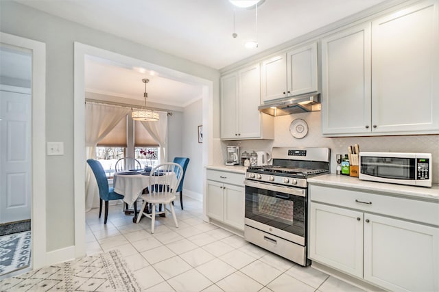 kitchen featuring gas stove, white cabinetry, light tile patterned floors, and hanging light fixtures